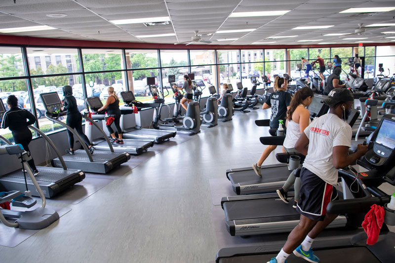Students working out on treadmills at Campus Rec